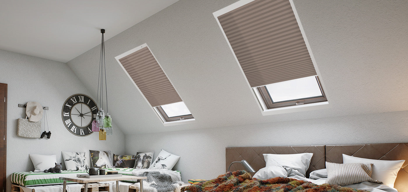 The window in the attic bedroom is fitted with a skylight shade