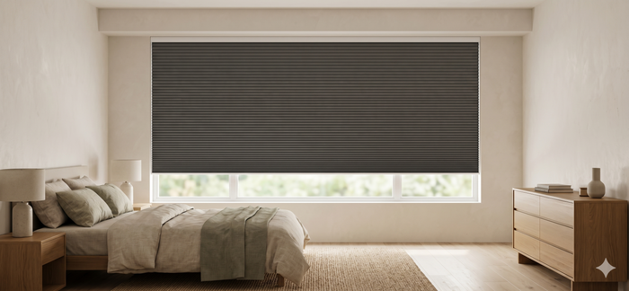 Motorized cellular shades installed in a modern bedroom , providing light control, privacy, and energy-efficient comfort.