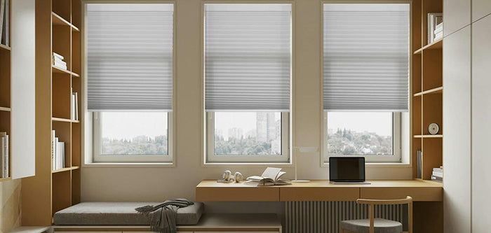 Cellular shades feature a honeycomb structure that traps air, keeping rooms cooler in summer and warmer in winter. The accordion-like folds expand when the shade is lowered, giving them a unique appearance.