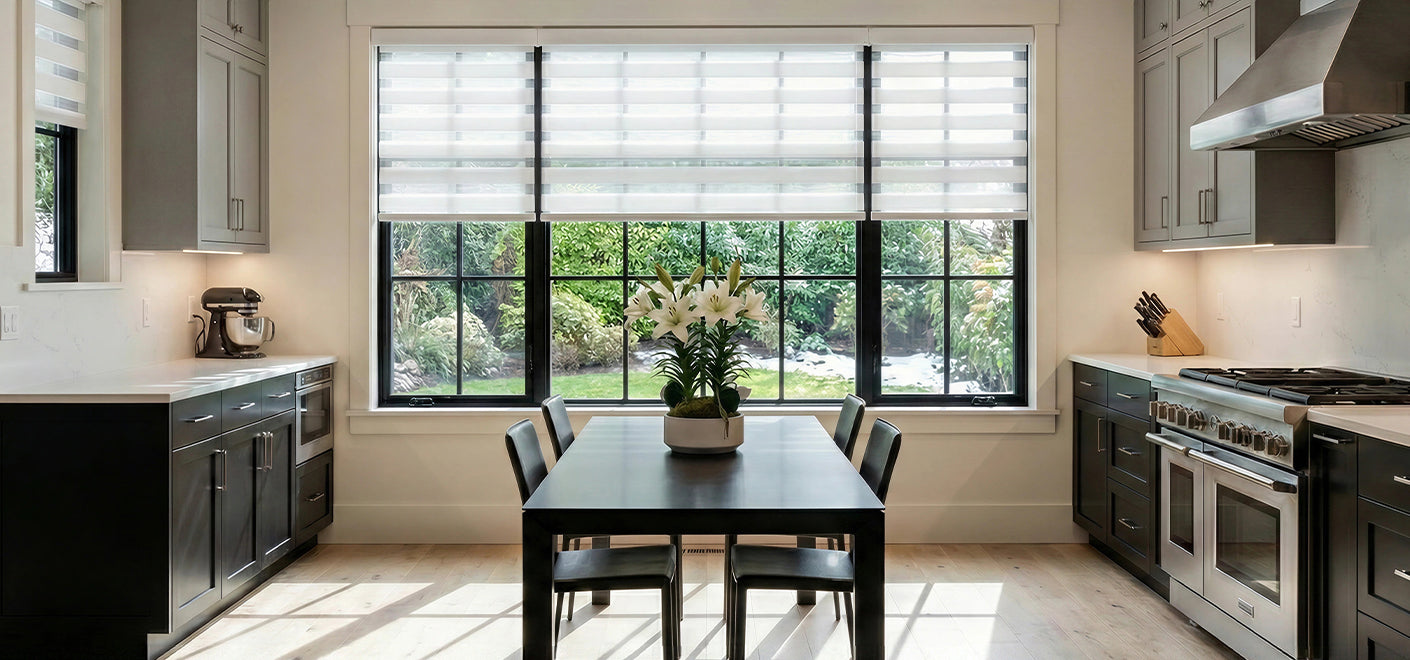 White motorized zebra blinds are installed on the window next to the kitchen dining table.