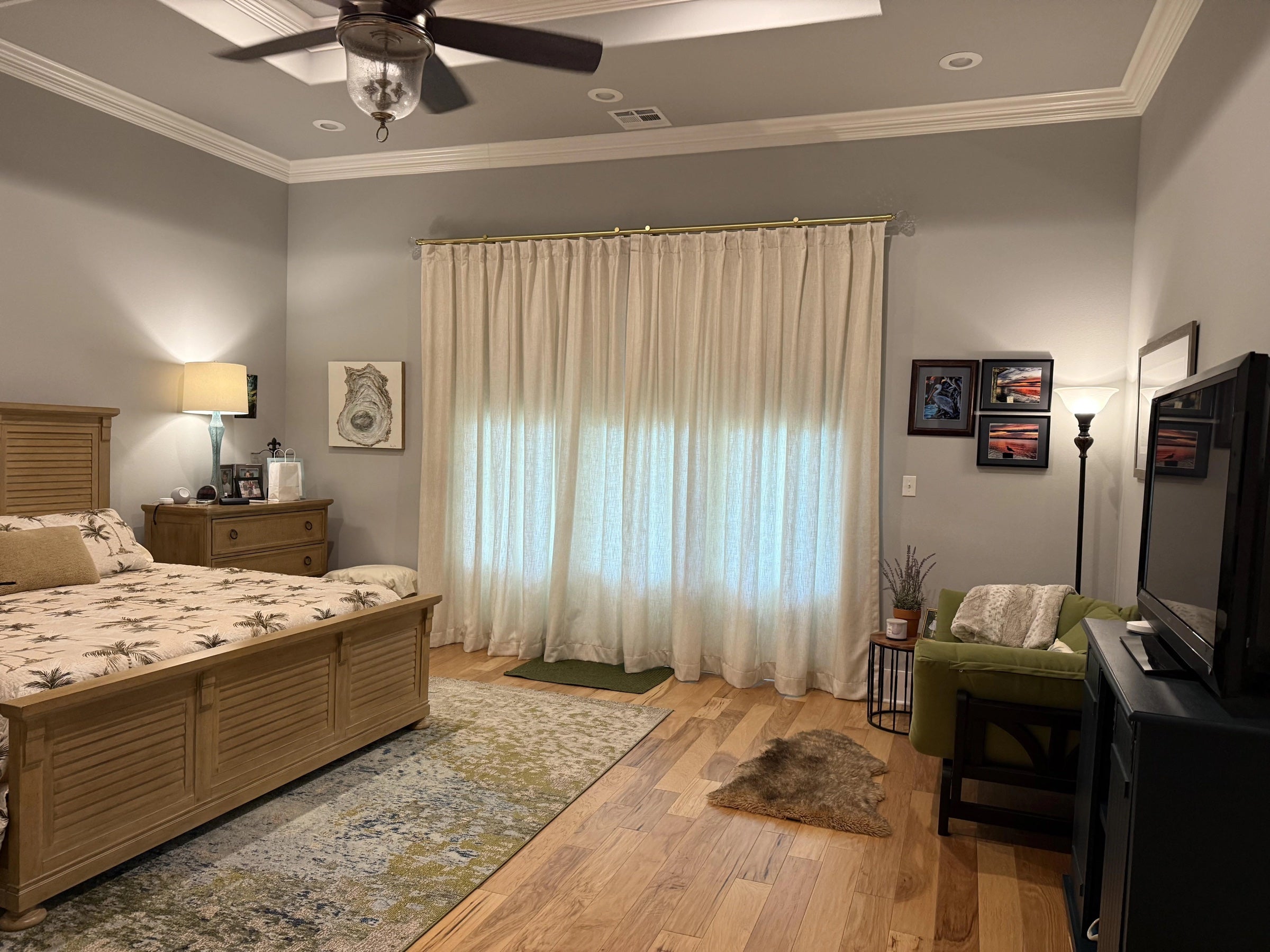 Motorized drapery in a warm bedroom