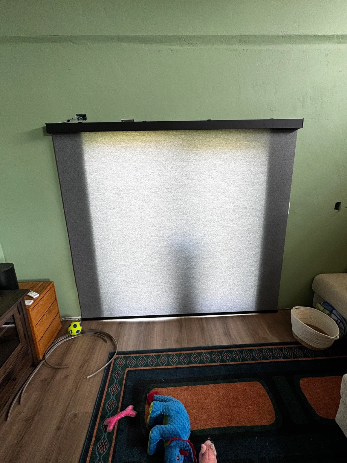 Large SmartWings PoE shade installed in a homeowner's living room