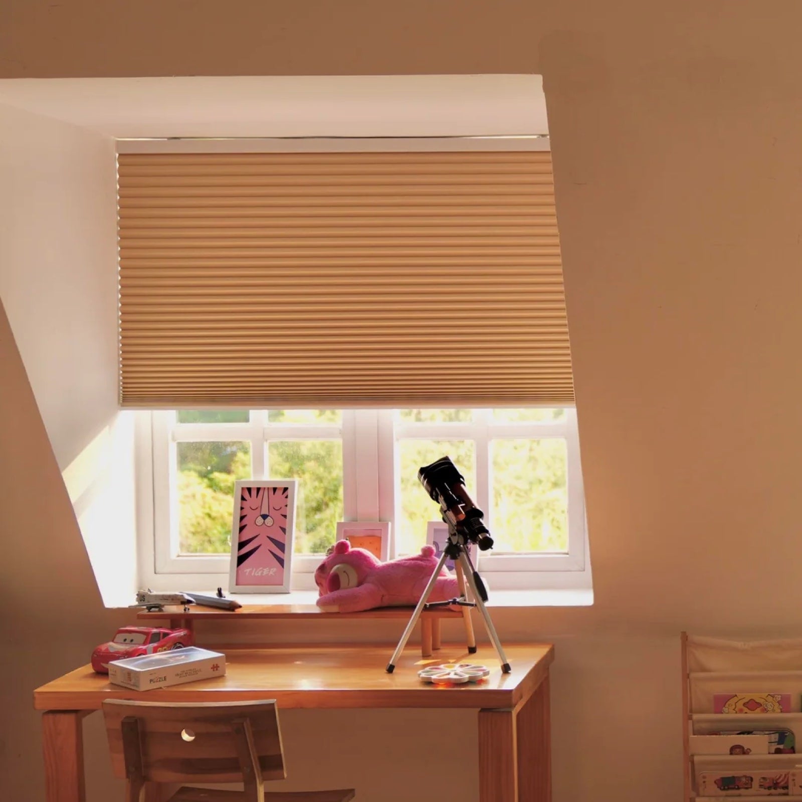 Cellular shade controlling summer sunlight in a bright attic room